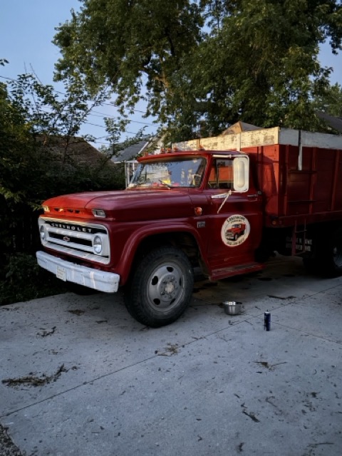 Lakeshore Loaders classic red dump truck ready for junk removal in Holland, MI
